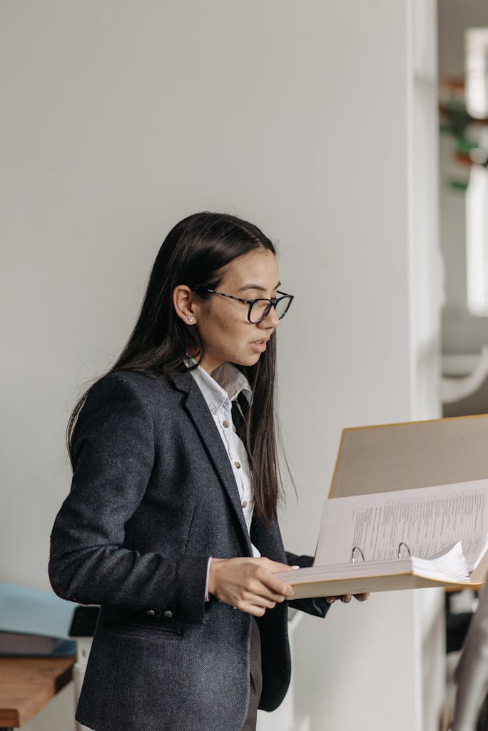 Woman in Black Blazer Holding Documents